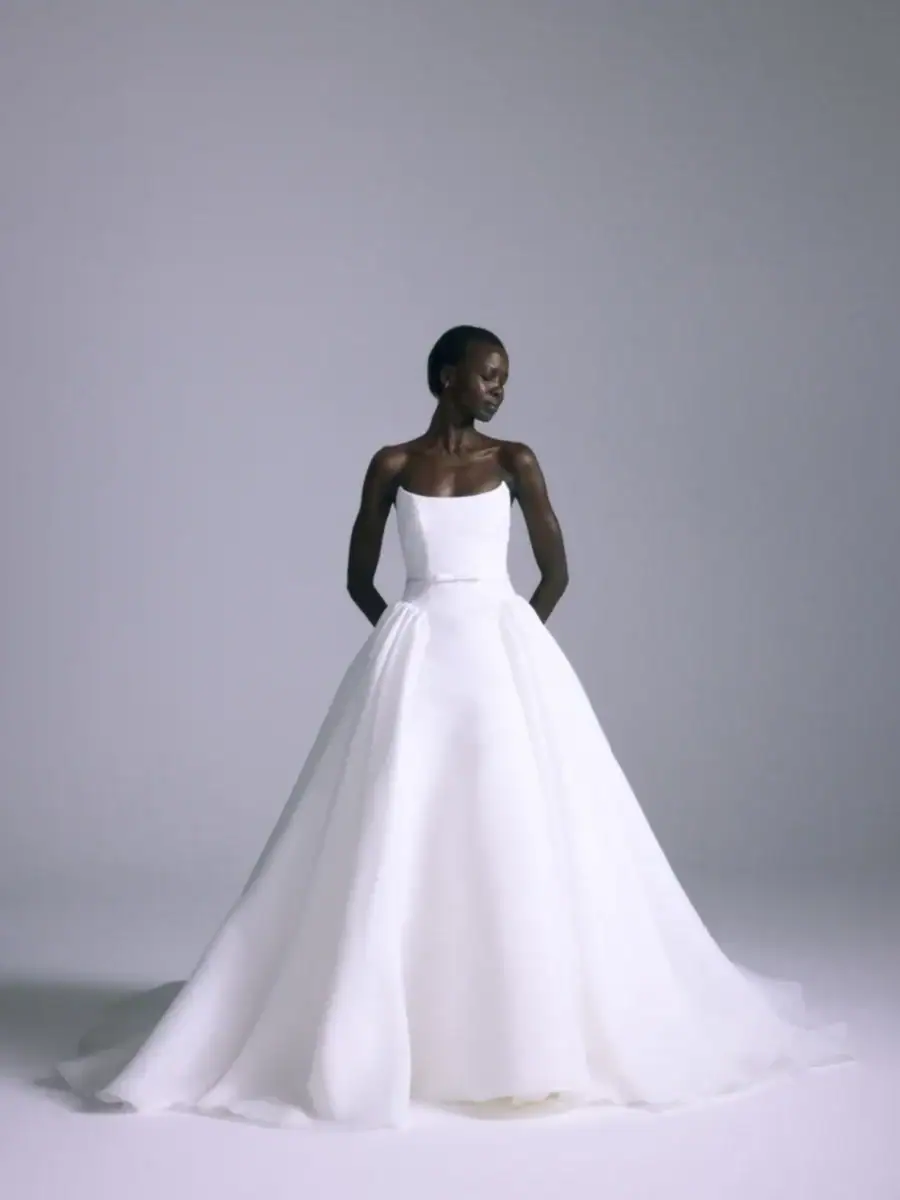 full front of amsale camelia ivory gazar ball gown wedding dress with a drop waist and bow accent at the waist