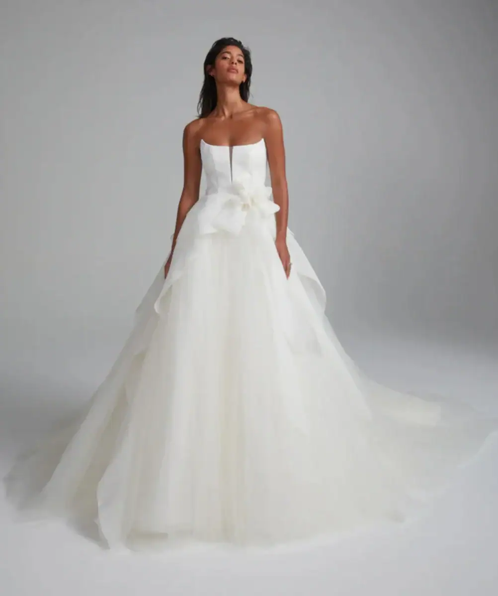 Tulle ball gown wedding dress with floral accent