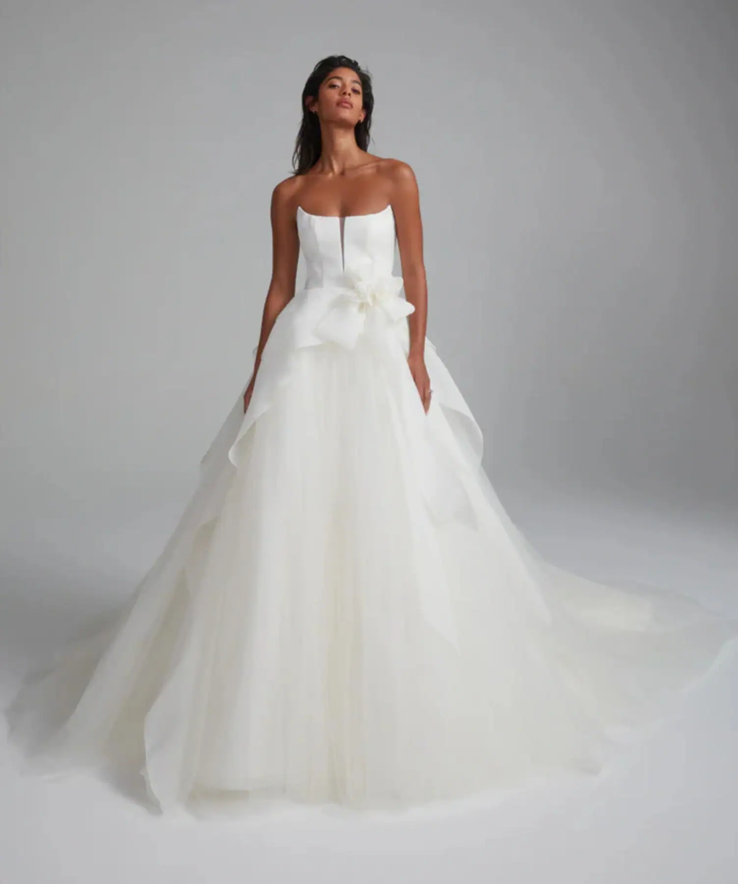 Tulle ball gown wedding dress with floral accent