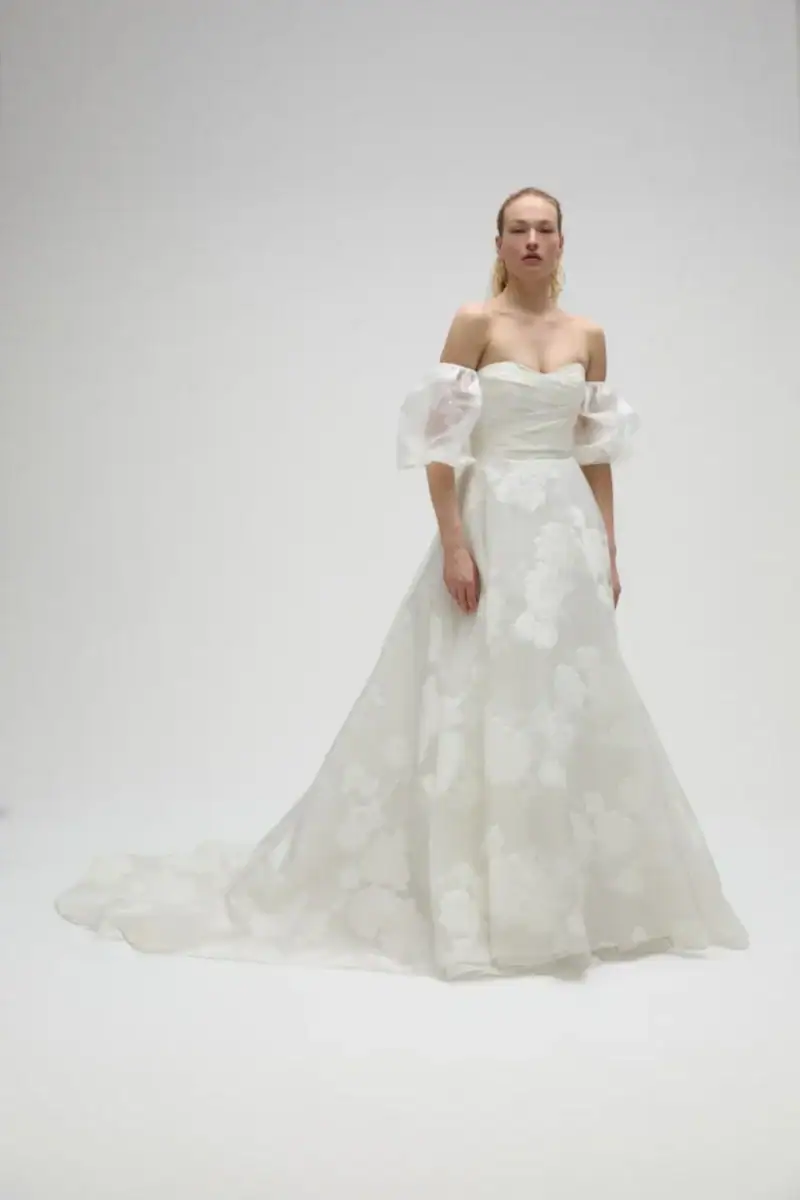 full front of amsale marcelina ivory printed ball gown wedding dress with large floral motifs and detached short puffed sleeves