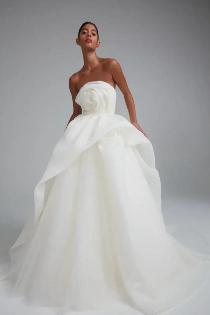full front of amsale rosemary ivory organza ball gown wedding dress featuring a dimensional floral bodice and draped skirt