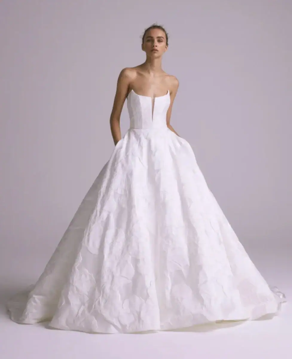 Textured ball gown wedding dress with strapless bodice and pockets