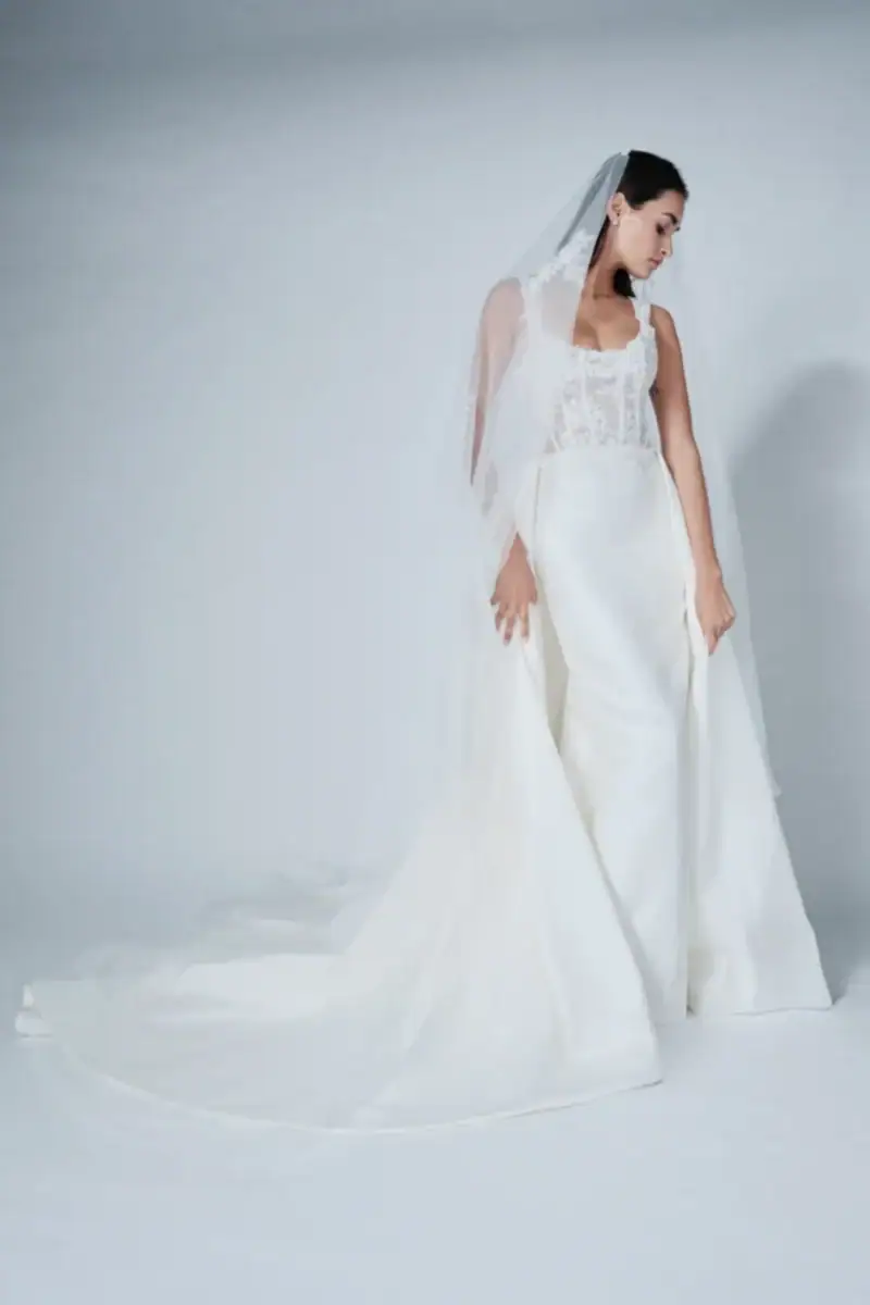 full front of bliss by monique lhuillier bl26204 mikado fitted wedding dress with a matching cathedral veil
