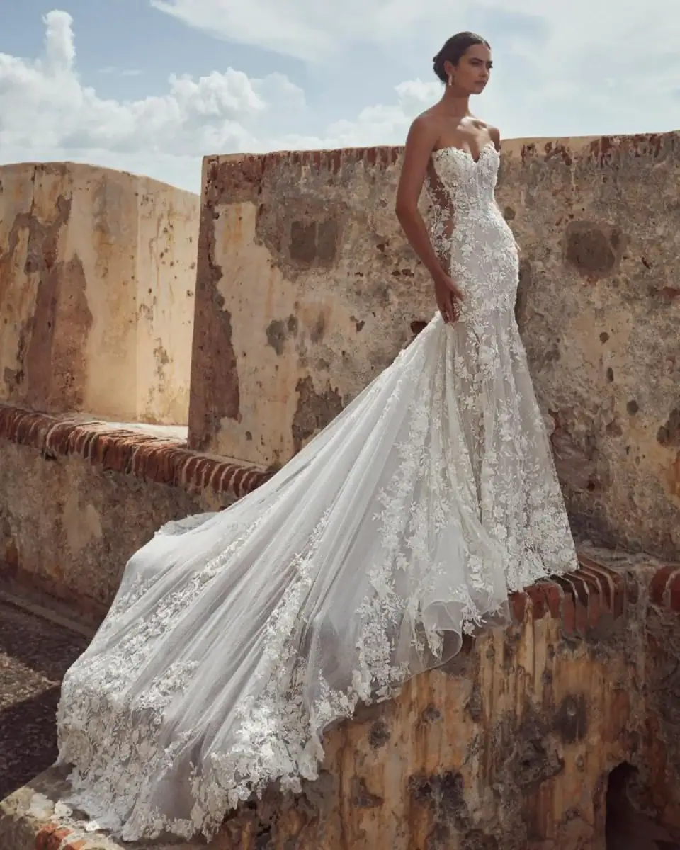 Lace fit and flare wedding dress with cathedral train and sheer sides