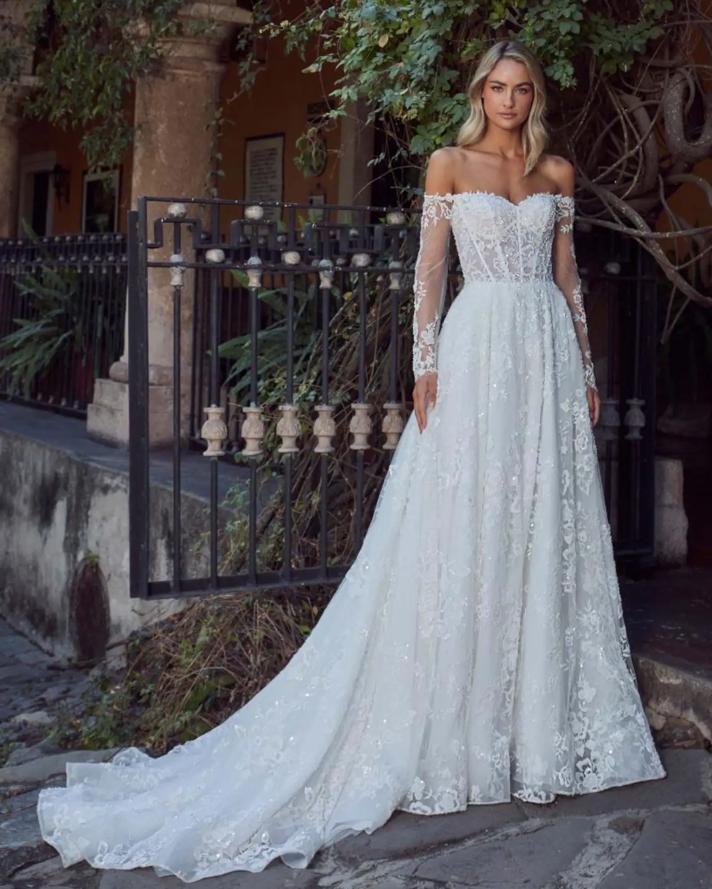Lace A-line wedding dress with off the shoulder long sleeves
