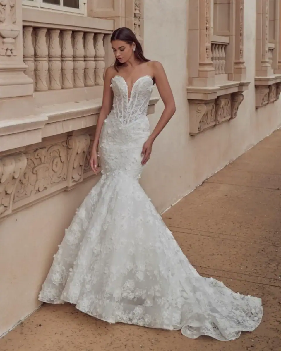 full front of calla blanche negin ivory lace fit and flare wedding dress with a deep strapless sweetheart neckline