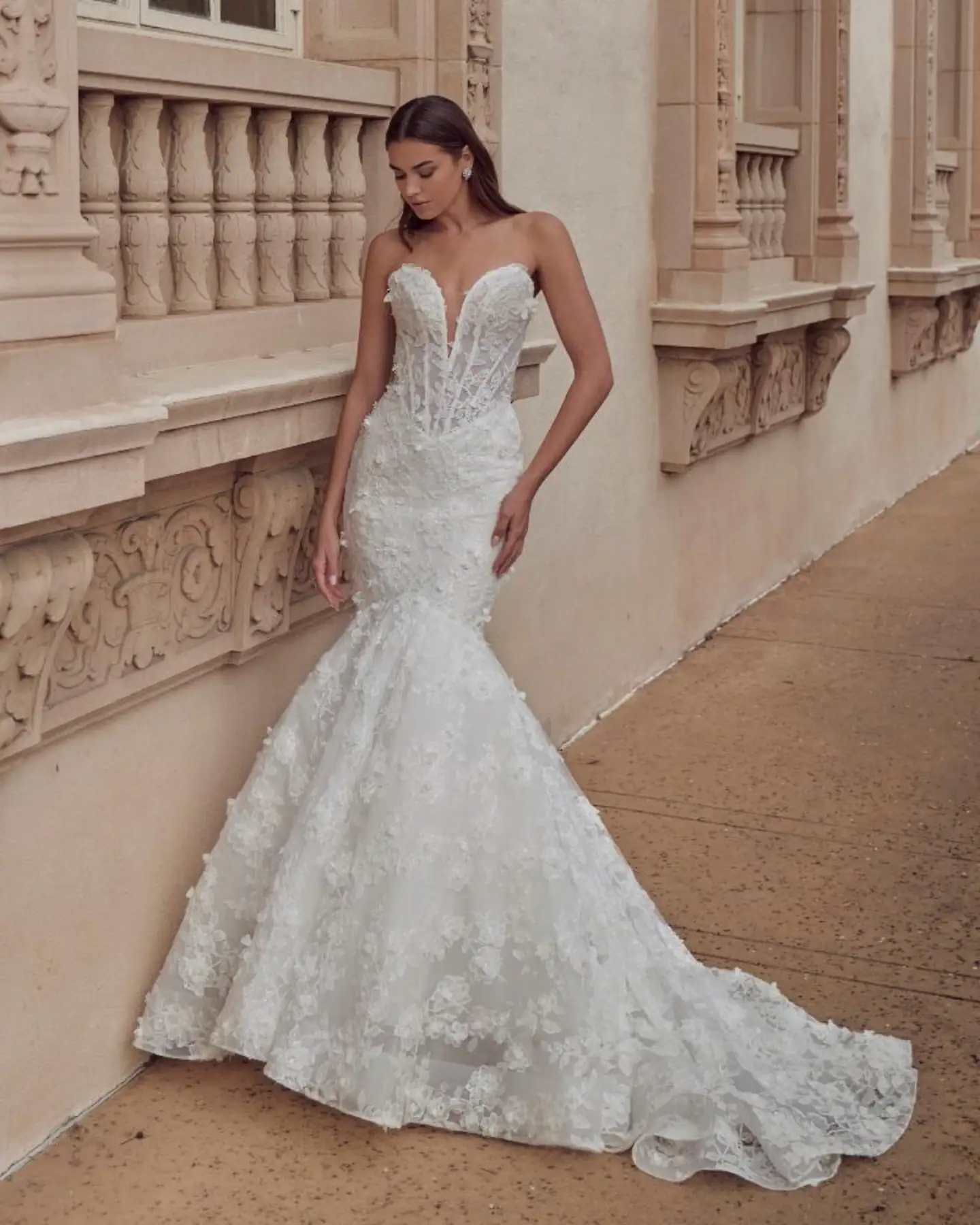 full front of calla blanche negin ivory lace fit and flare wedding dress with a deep strapless sweetheart neckline