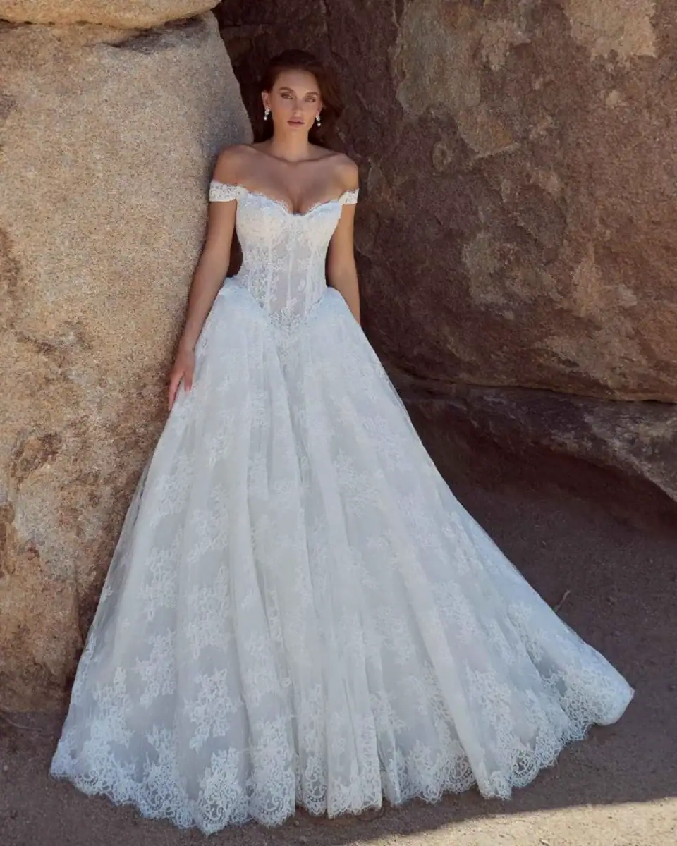 calla blanche lace ball gown wedding dress with basque waist and off the shoulder neckline