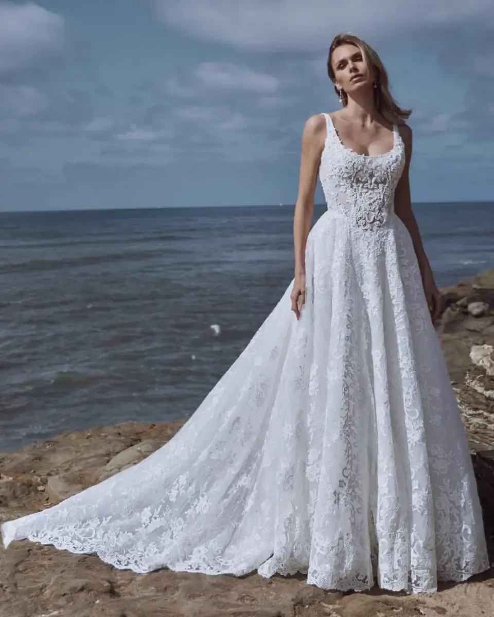 full front of calla blanche suzette ivory lace a-line wedding dress with a square neckline and basque waist
