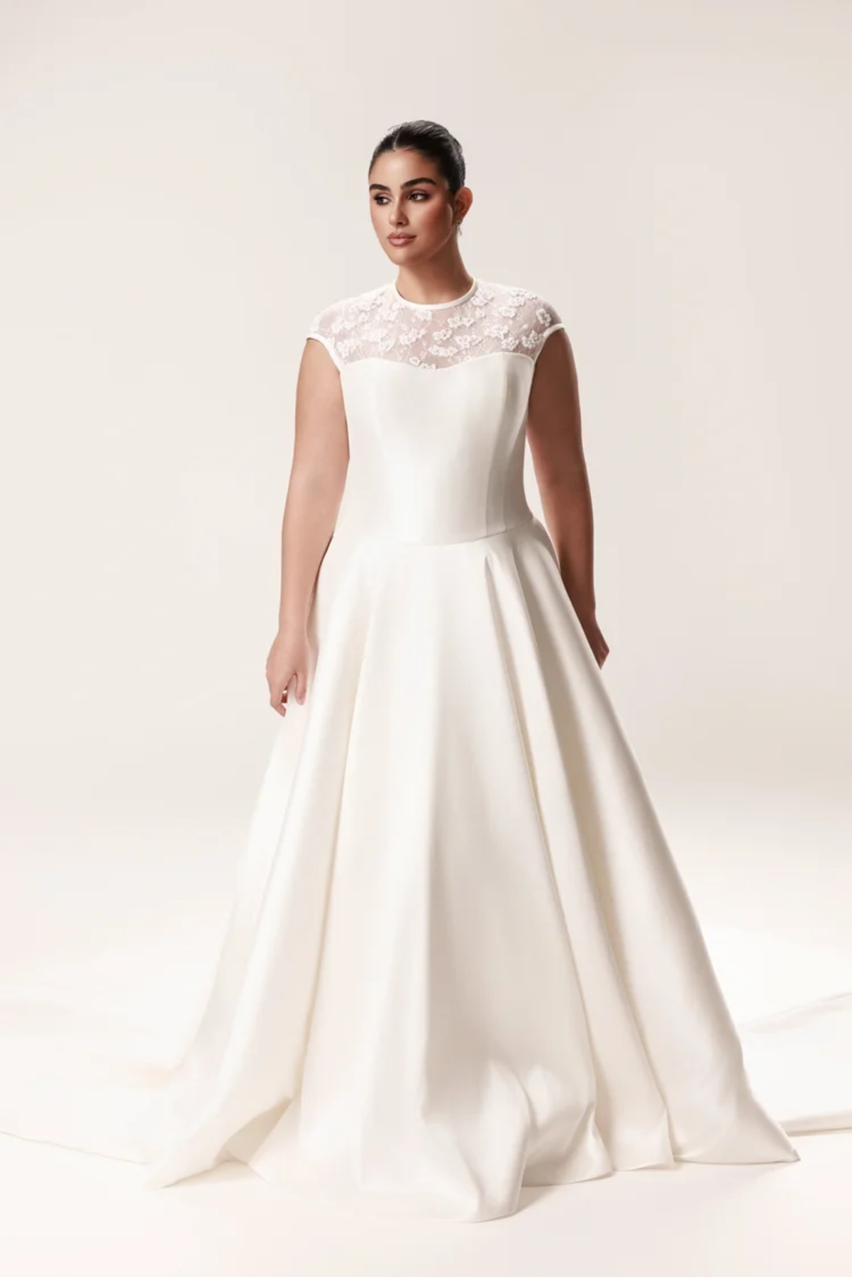 modest a-line wedding dress with lace details on bodice