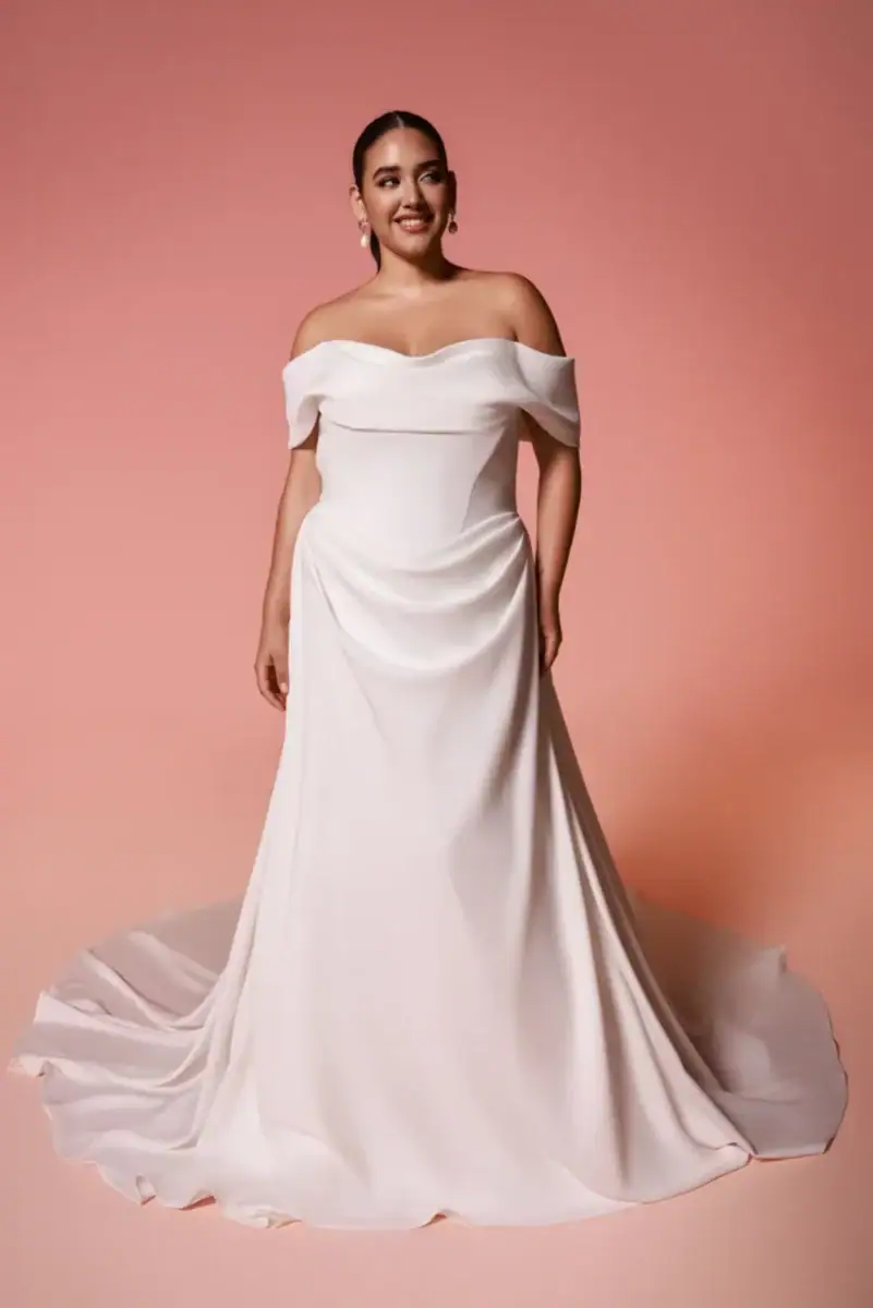 full front of dany girl vale ivory crepe sheath wedding dress with a draped bodice and off the shoulder neckline with thick straps