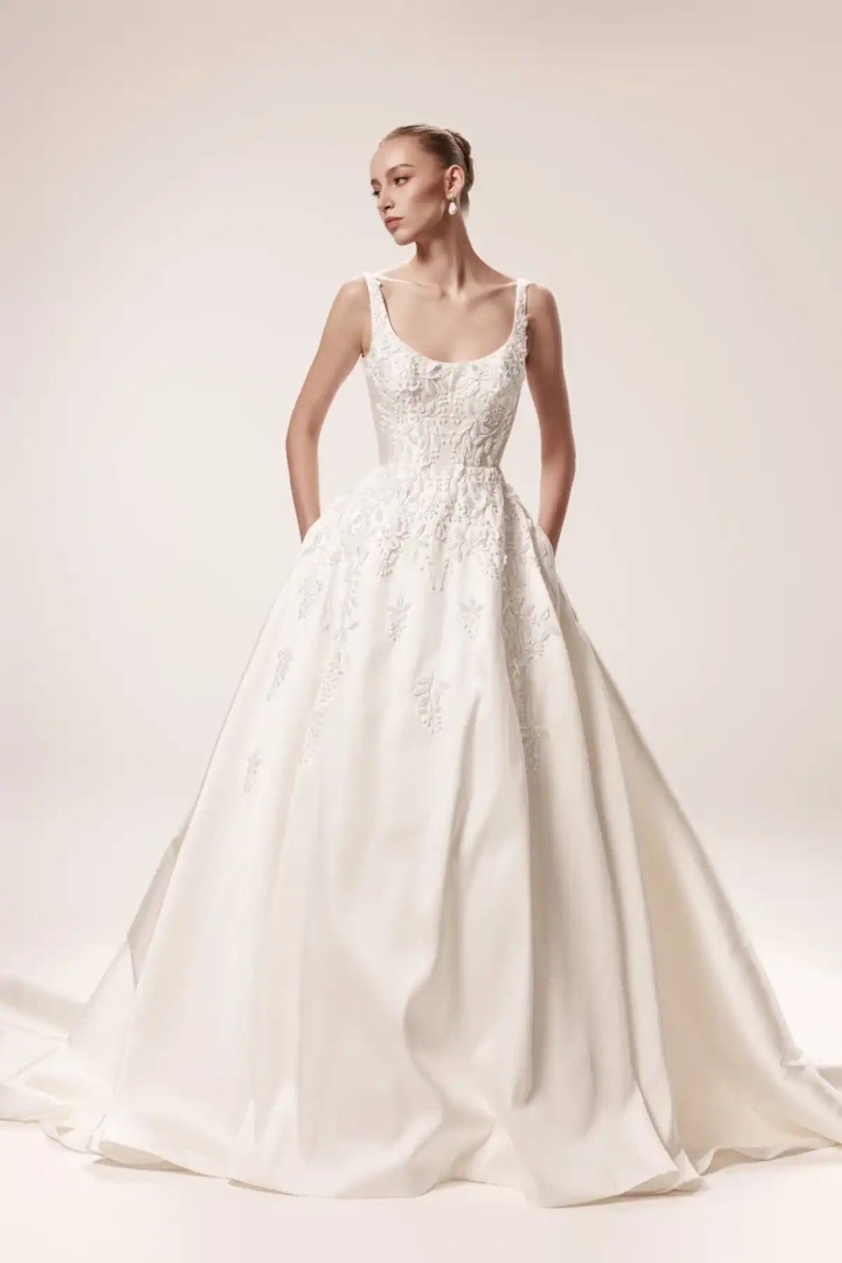 Silky ball gown wedding dress with floral embroidery and pockets