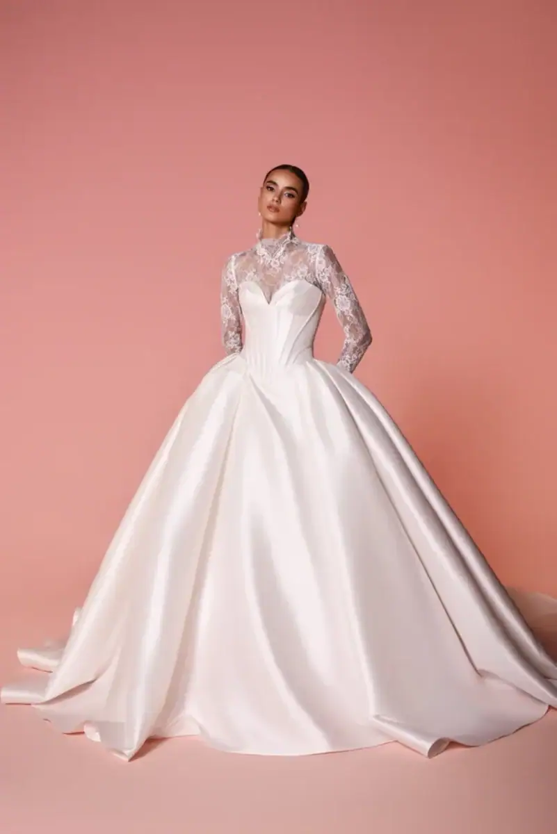 full front of dany tabet cedra ivory drop waist ball gown wedding dress with a matching long sleeve lace jacket