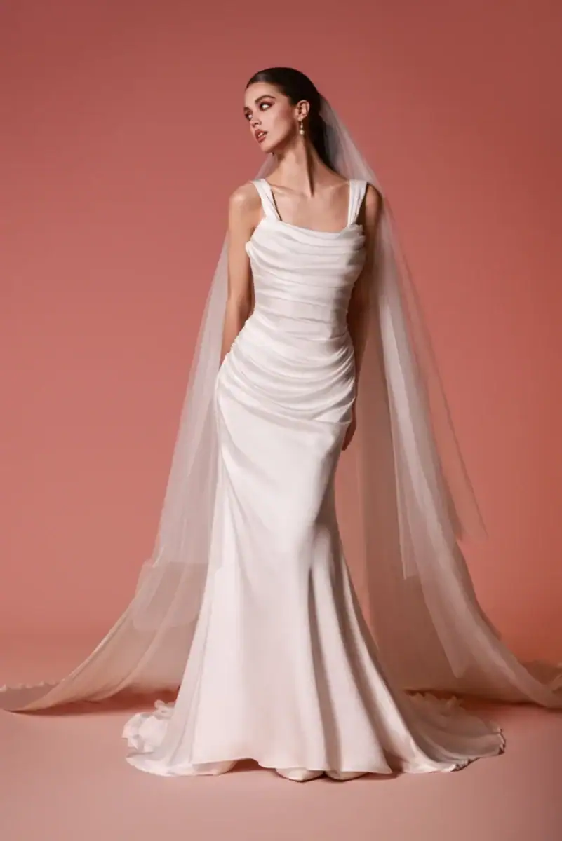 full front of dany tabet lior ivory silky fitted wedding dress with a draped bodice and matching veil