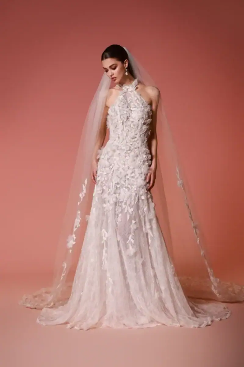 full front of dany tabet marielle ivory lace fit and flare wedding dress with a halter neckline and matching veil