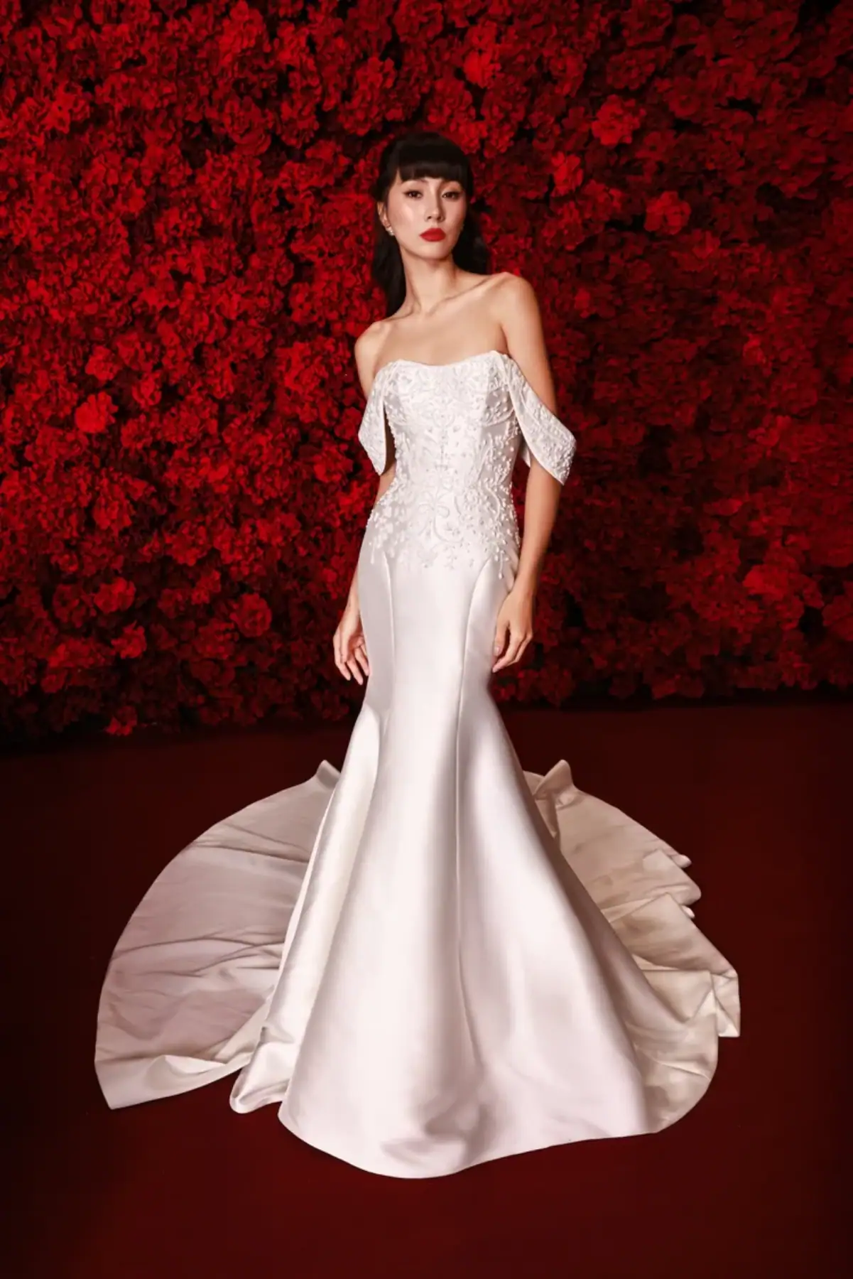 Silky fit and flare wedding dress with embroidered details and matching straps