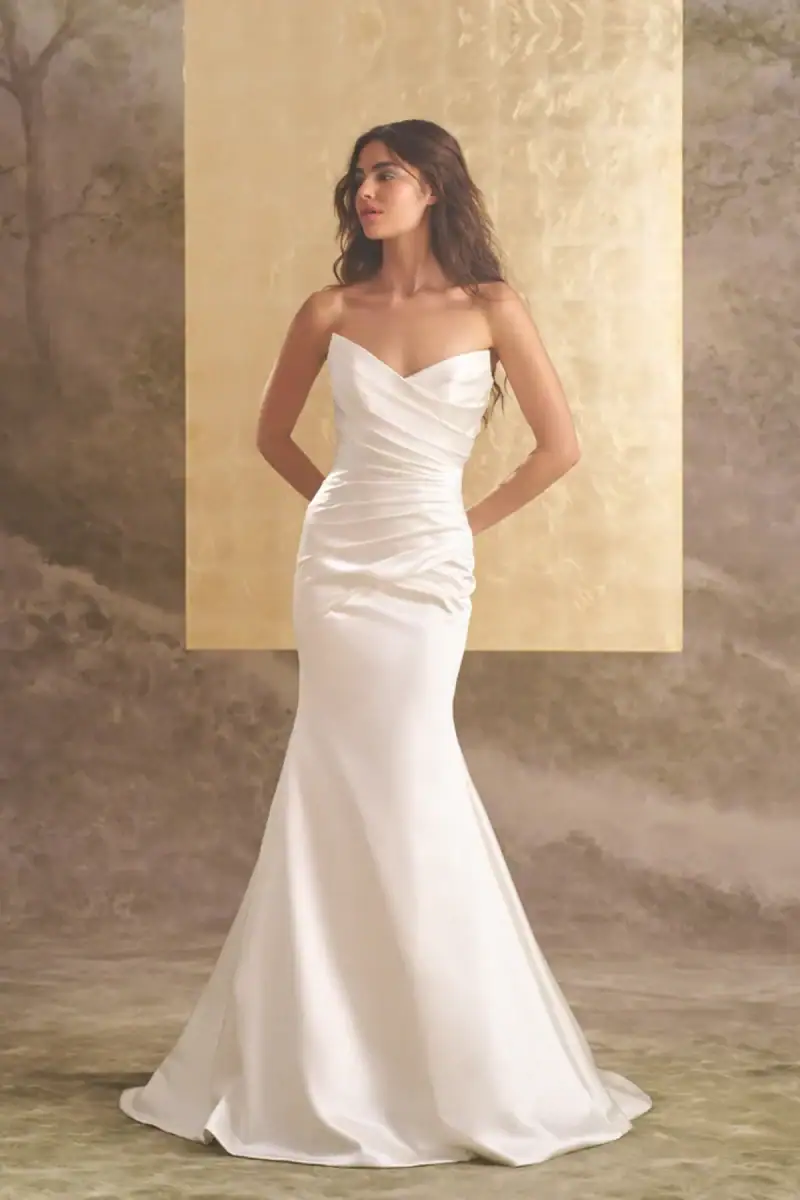 Silky fit and flare wedding dress with pointed V neckline and draped bodice