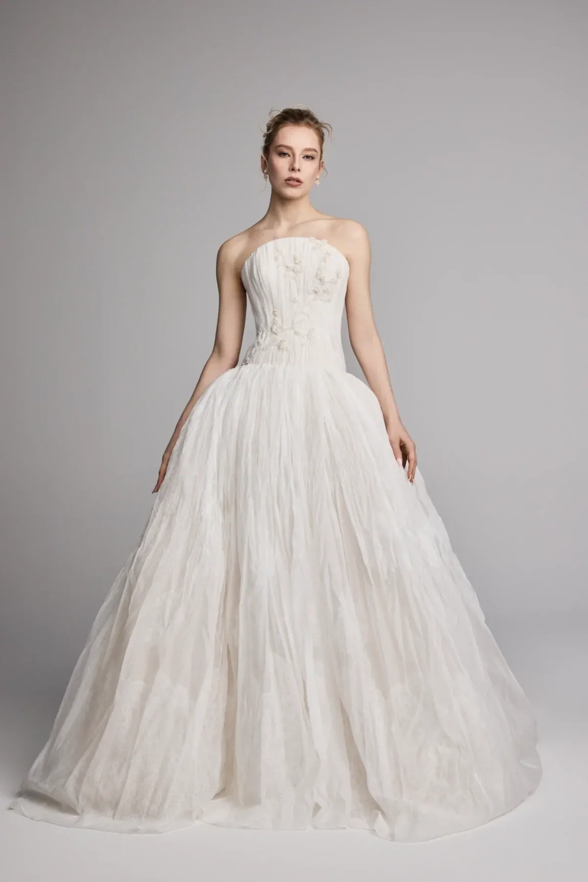full front of ines di santo verdant ivory ball gown wedding dress with a dropped waist and rounded strapless neckline