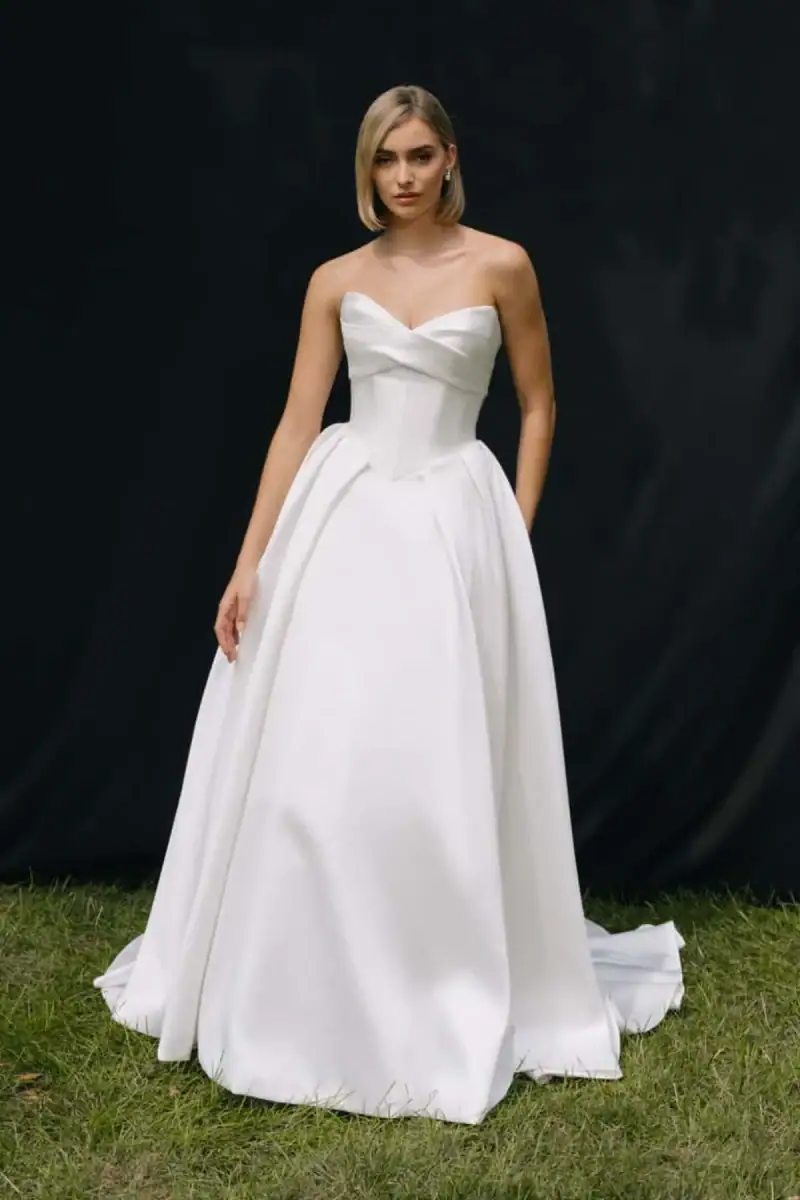 Ball gown wedding dress with basque waist and V neck bodice
