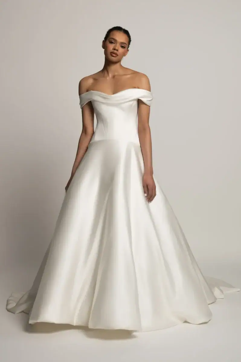 full front of jenny yoo greer ivory silky a-line wedding dress with an off the shoulder neckline