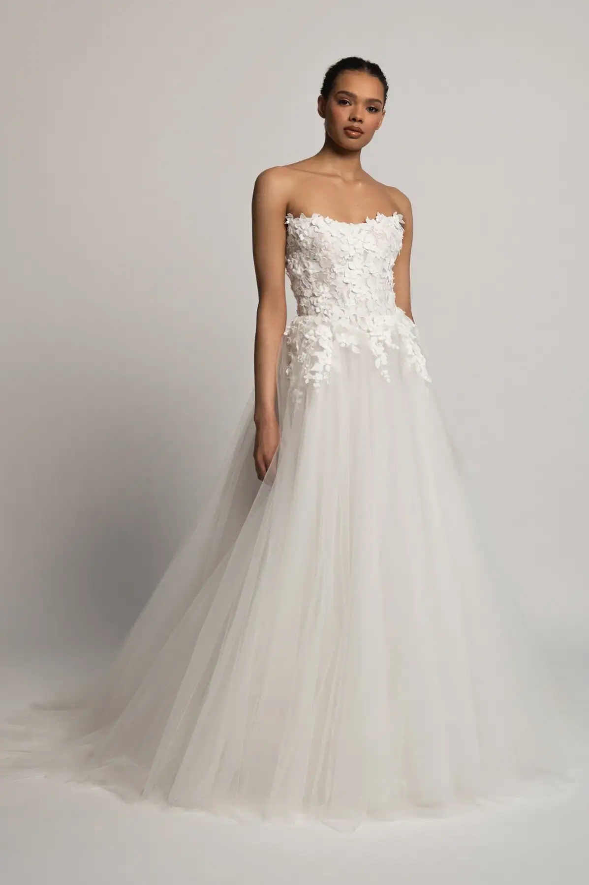 full front of jenny yoo romy ivory tulle ball gown wedding dress with lace accents and a strapless neckline