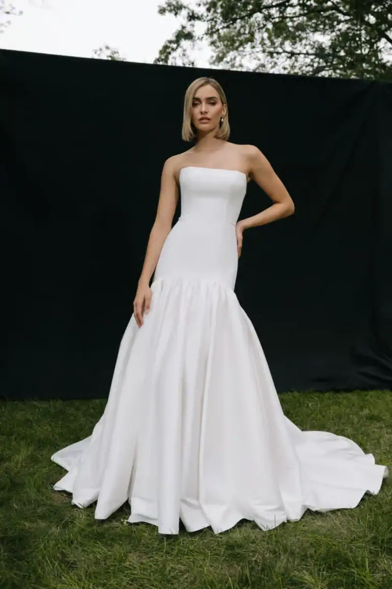 Drop waist wedding dress with straight neckline and waist belt
