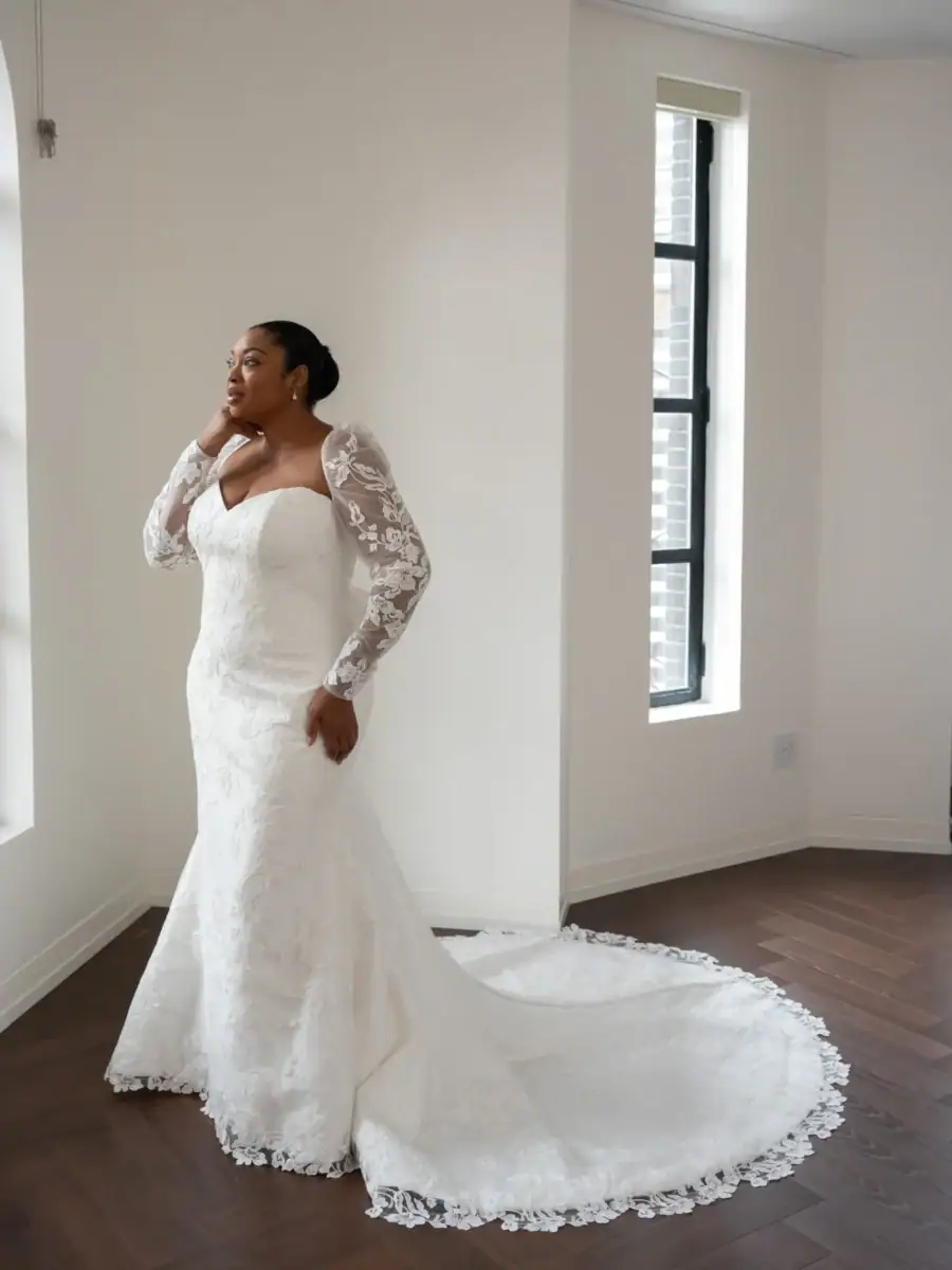 full front of kelly faetanini diana ivory fitted wedding dress with matching lace long sleeve topper
