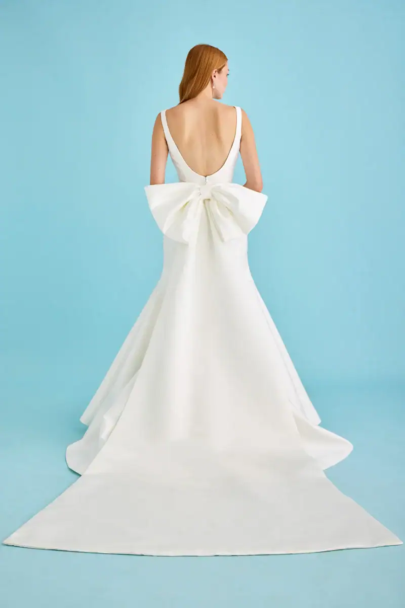 fit and flare wedding dress with large bow train at back