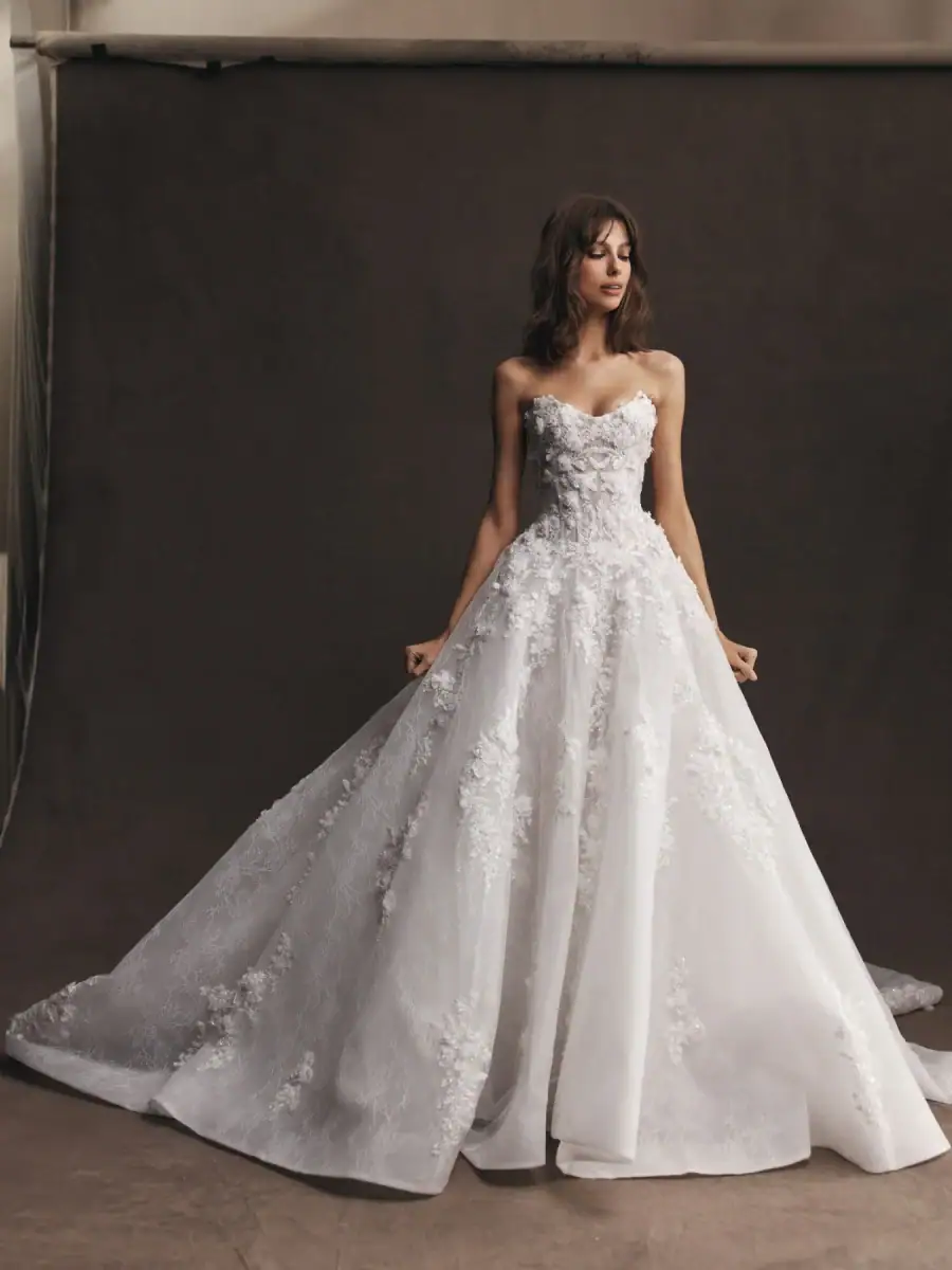 leah da gloria astrid tulle ball gown wedding dress with dimensional floral lace embellishments and strapless bodice