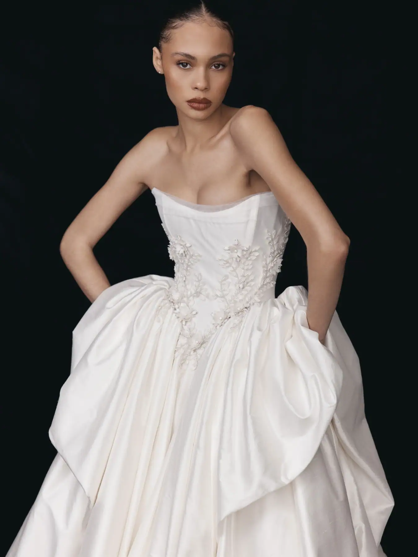 leah da gloria katya satin ball gown wedding dress with a basque waist and pearl accents on the bodice