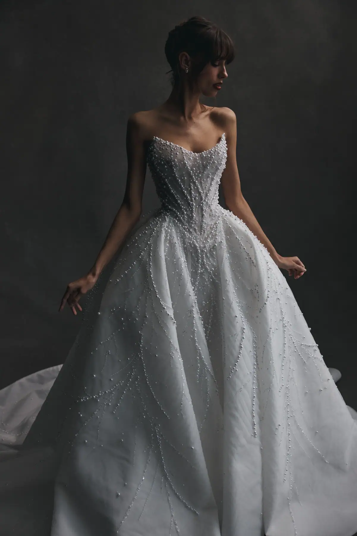 leah da gloria nerine tulle drop waist wedding dress adorned with beading scattered throughout, with a strapless scoop neckline