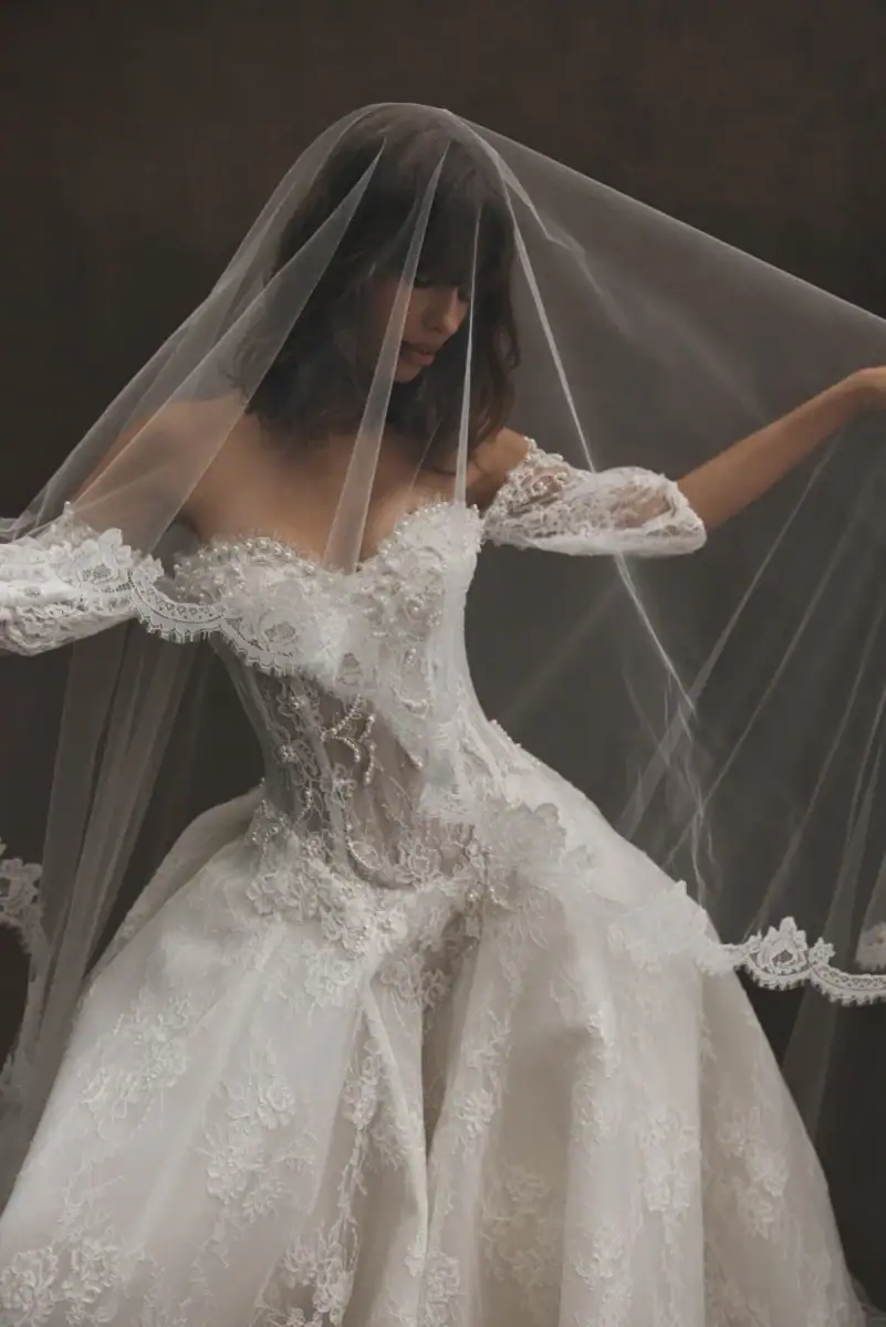 leah da gloria scarlett lace ball gown wedding dress with basque waist and pearl accents throughout