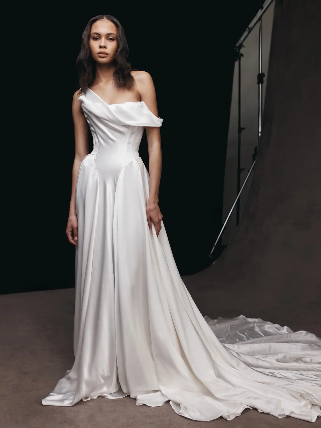 leah da gloria willa satin drop waist wedding dress with one shoulder neckline and flowy skirt that extends into a long train