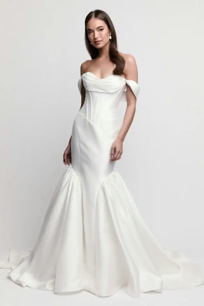 full front of locket by watters milady ivory silky fit and flare edding dress with a basque waist and off the shoulder neckline