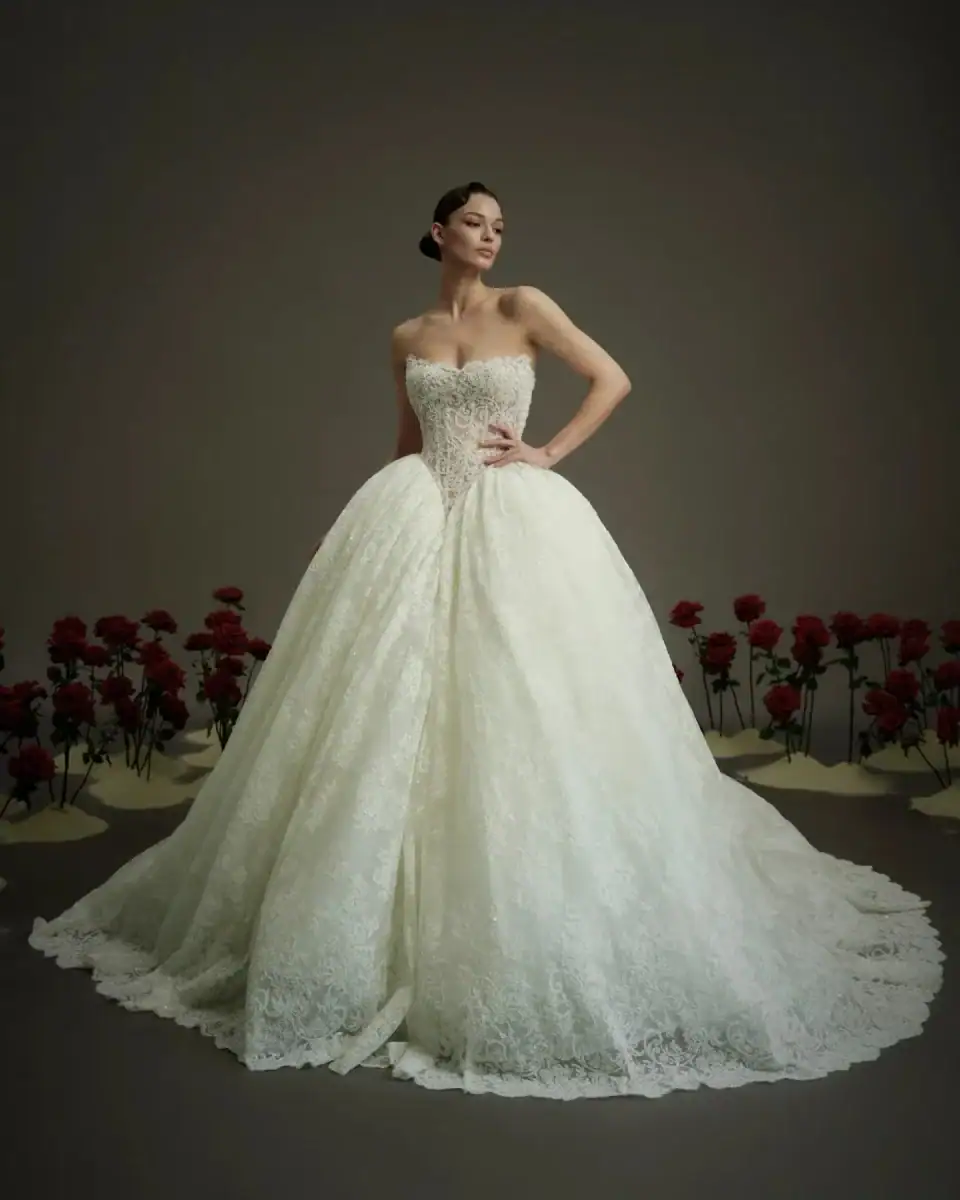 lace ball gown wedding dress with basque waist and V neckline