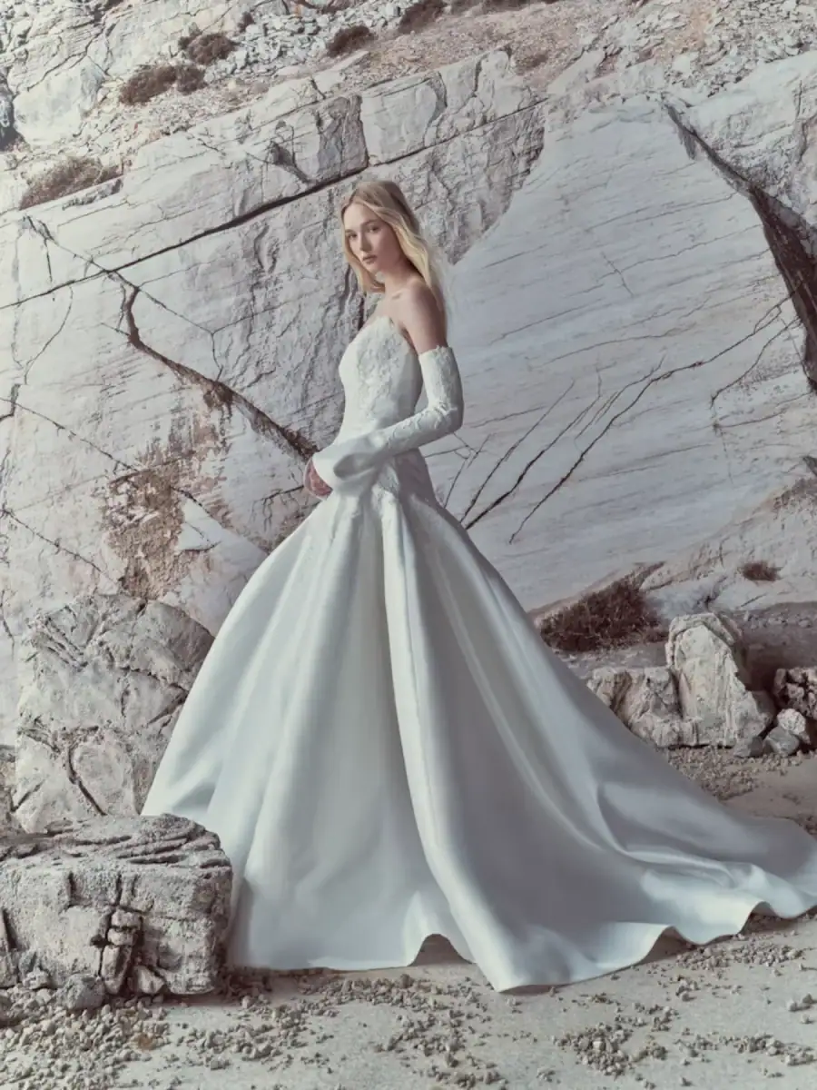 full ront of rivini luma ivory drop waist wedding dress with a lace bodice and matching long sleeves