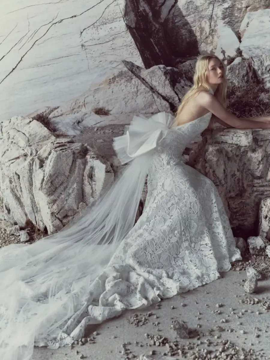 full front of rivini sylvie ivory lace fitted wedding dress with a matching tulle bow at the back
