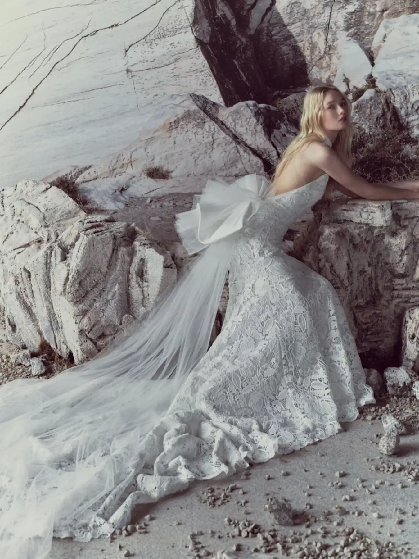 full front of rivini sylvie ivory lace fitted wedding dress with a matching tulle bow at the back