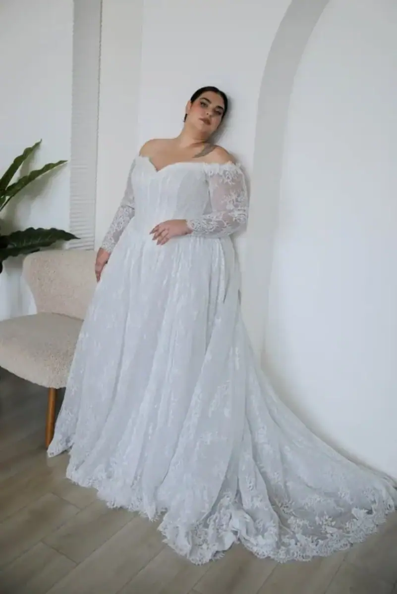 lace ball gown wedding dress with basque waist and off the shoulder long sleeves