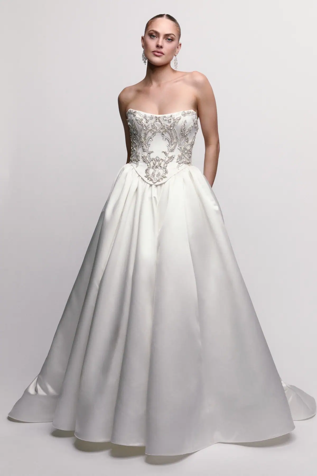 Silky ball gown wedding dress with beaded bodice and basque waist