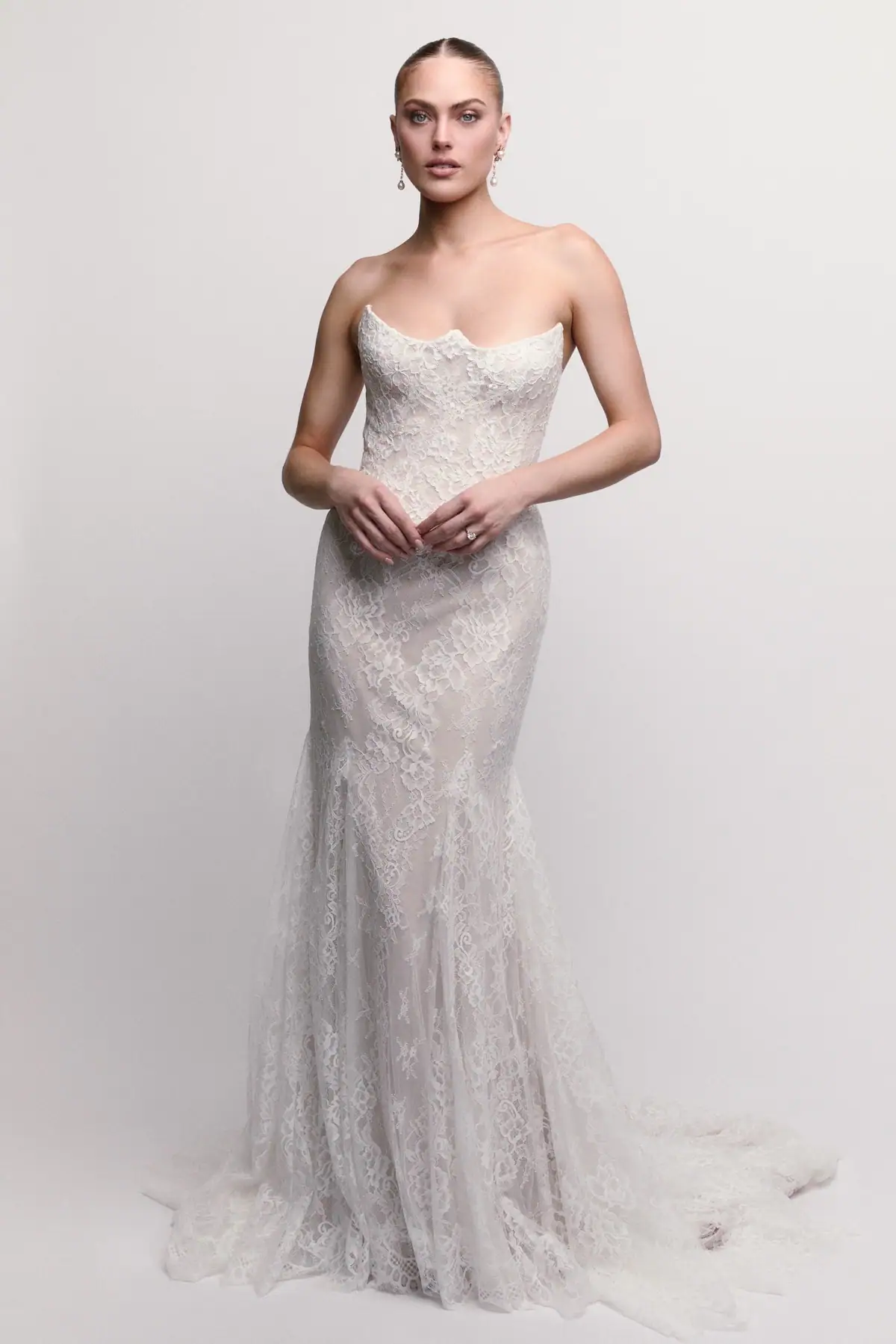 Lace sheath wedding dress with sculpted neckline
