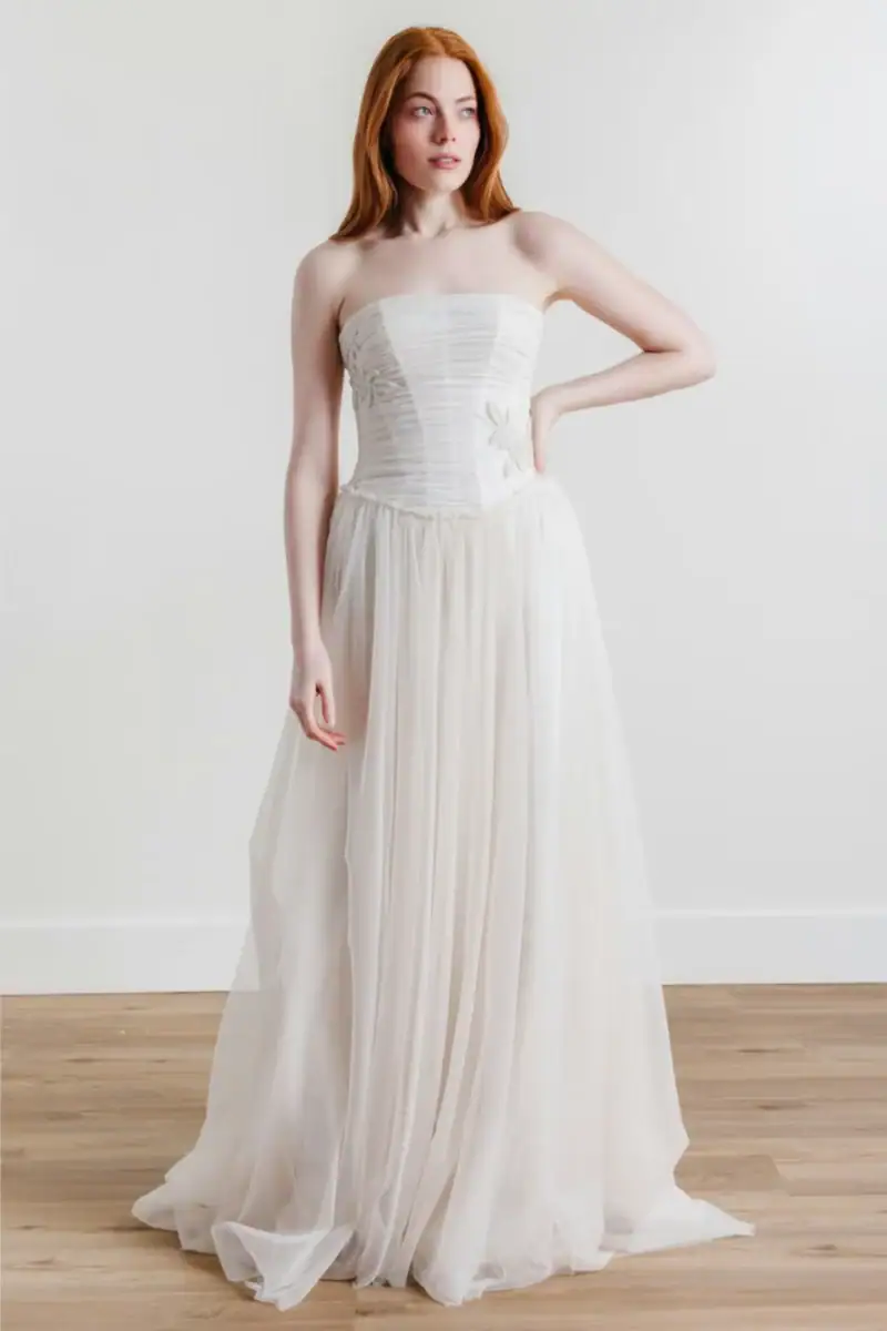 watters delia beaded tulle a-line wedding dress with a basque waist and beaded accents on the bodice