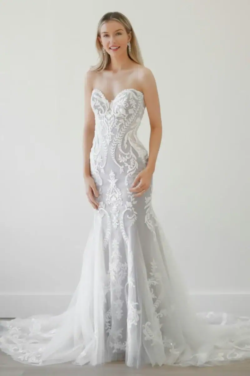 watters dennison tulle fitted wedding dress with intricate lace details and a strapless sweetheart bodice