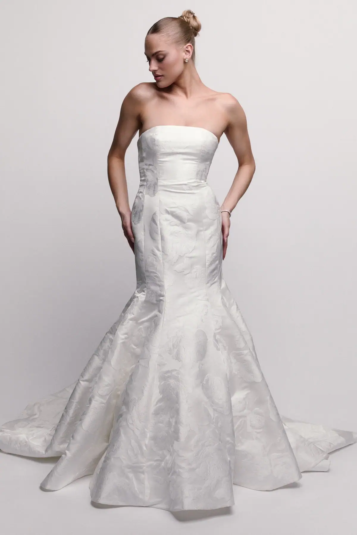 Silky fit and flare wedding dress with floral motifs